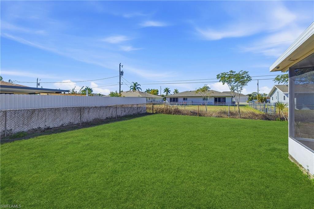 View of fenced backyard