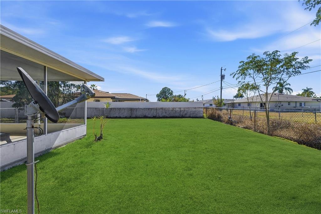 View of fenced backyard