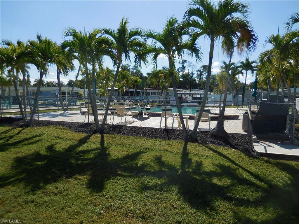 View of property's community pool and deck
