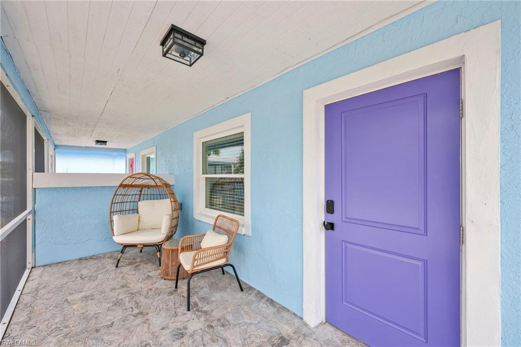 Doorway to property with stucco siding