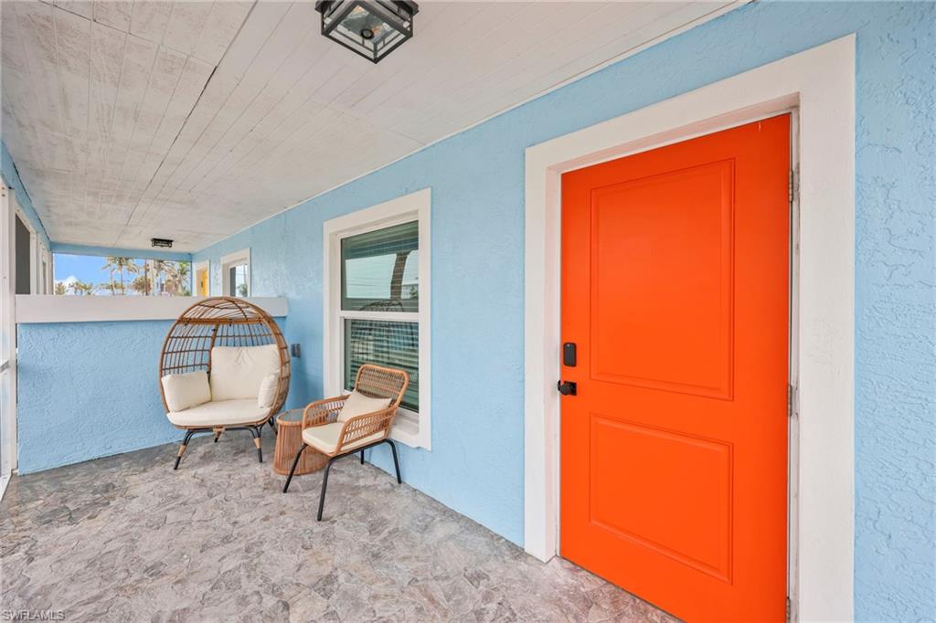View of exterior entry with stucco siding