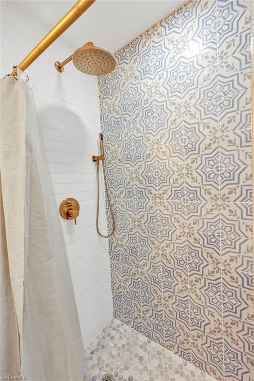 Full bathroom with a shower stall