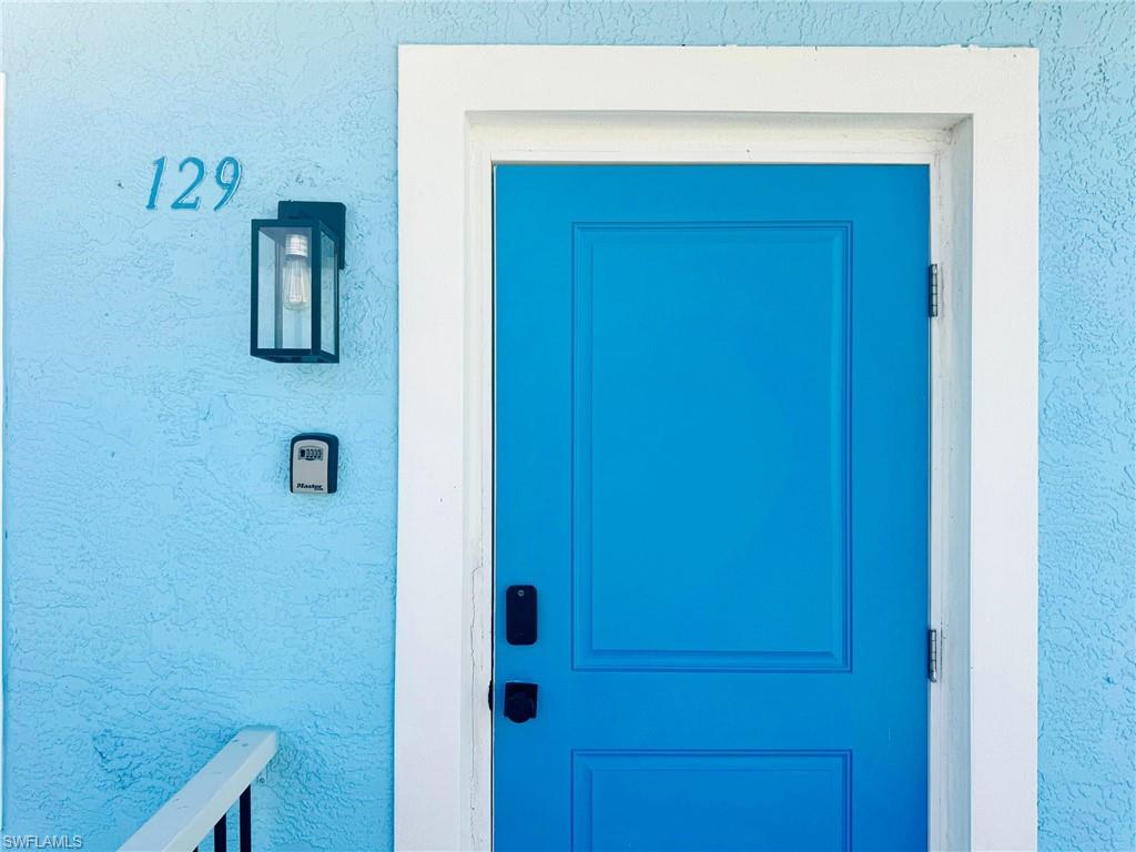 Entrance to property featuring stucco siding