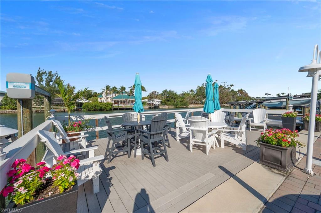 Wooden terrace featuring a water view