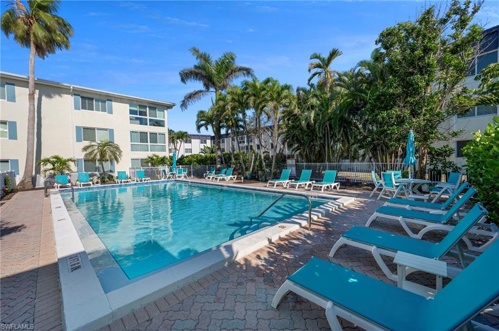 Community pool featuring a patio area