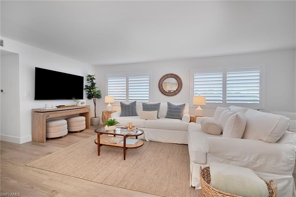 Living room featuring wood finished floors and baseboards