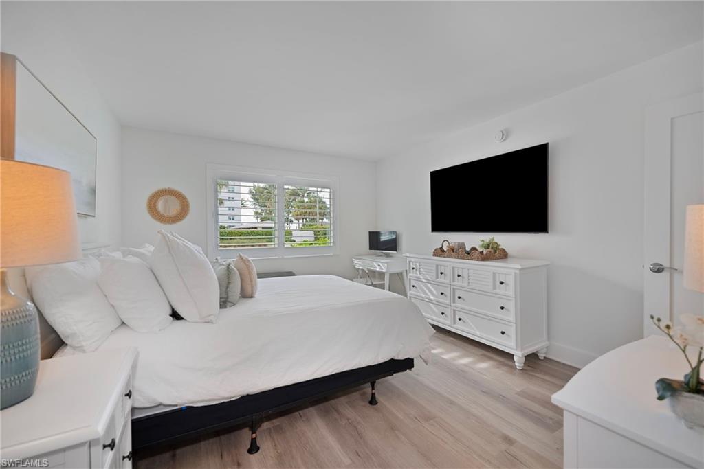 Bedroom featuring light wood-type flooring and baseboards