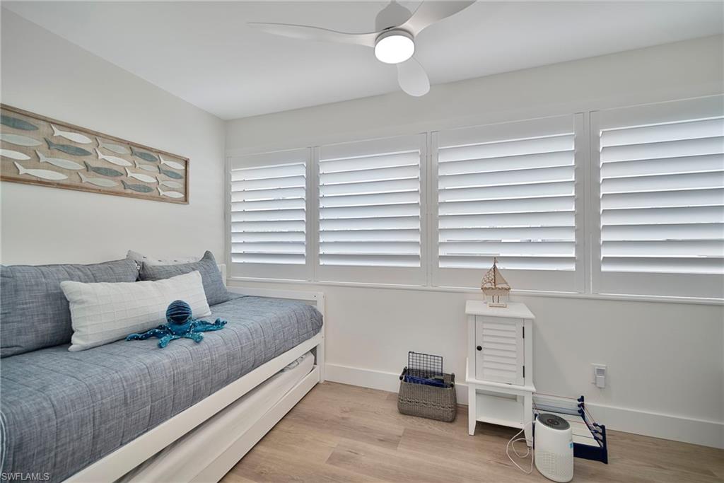 Bedroom with light wood-type flooring and ceiling fan