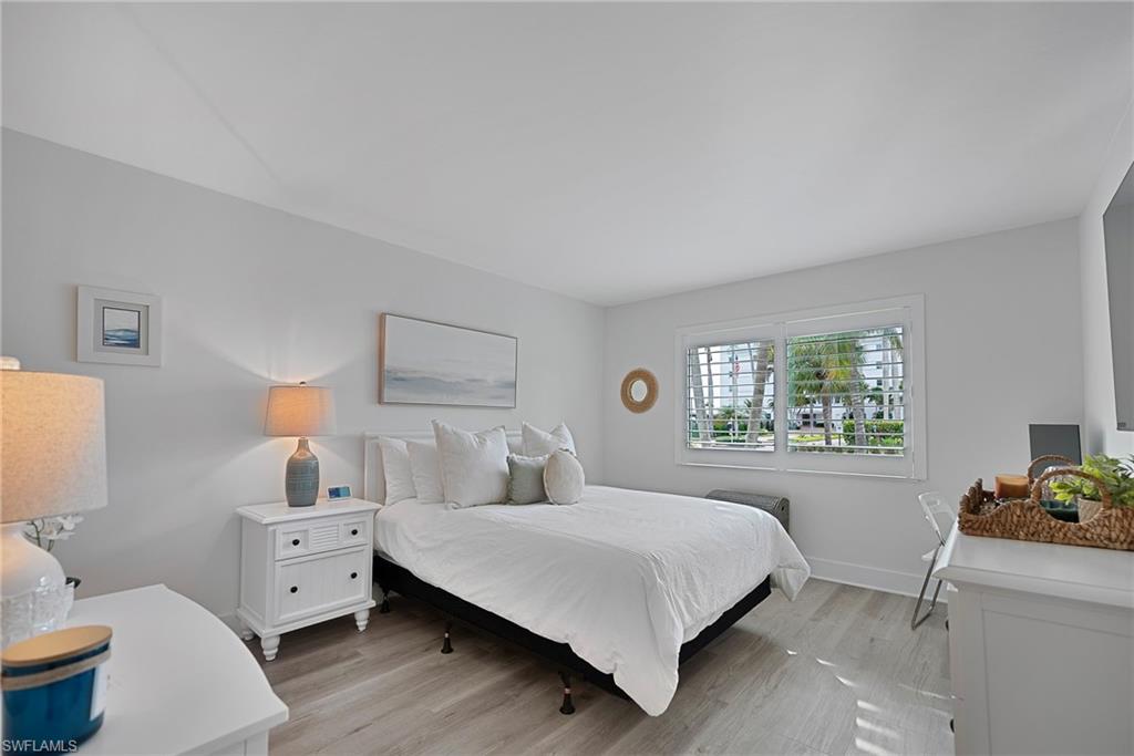 Bedroom featuring light wood-style flooring and baseboards