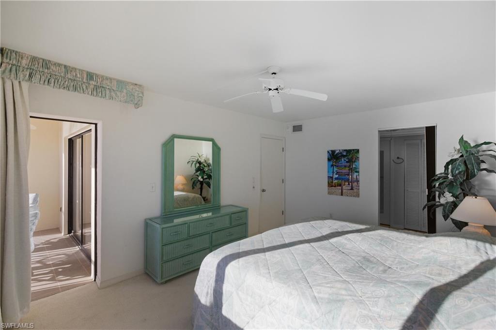 Primary bedroom with glass door out to lanai
