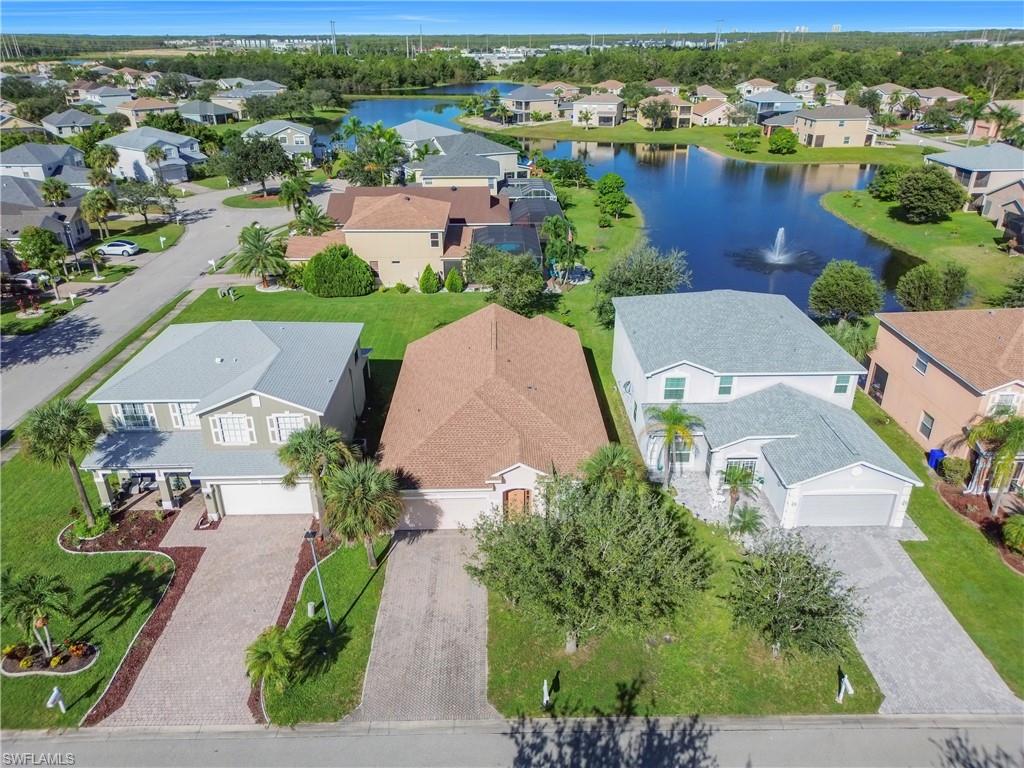 Aerial perspective of suburban area with a large body of water