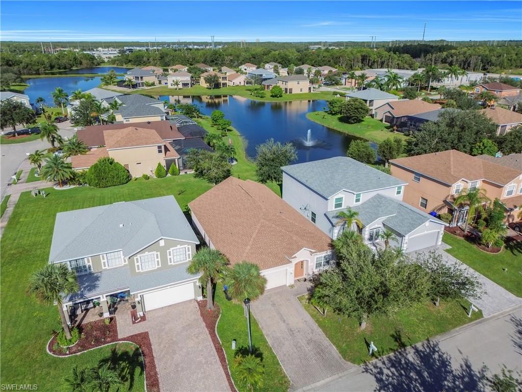 Aerial view of residential area featuring a large body of water