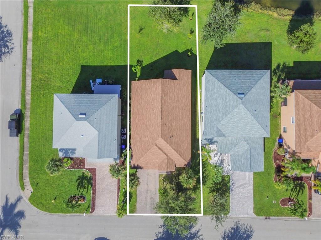 Aerial view of property and surrounding area with property boundaries highlighted