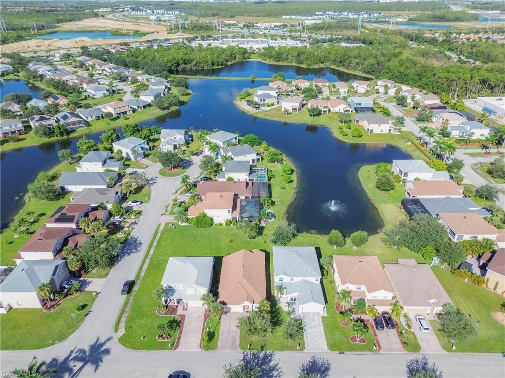 View of property location with a large body of water and nearby suburban area