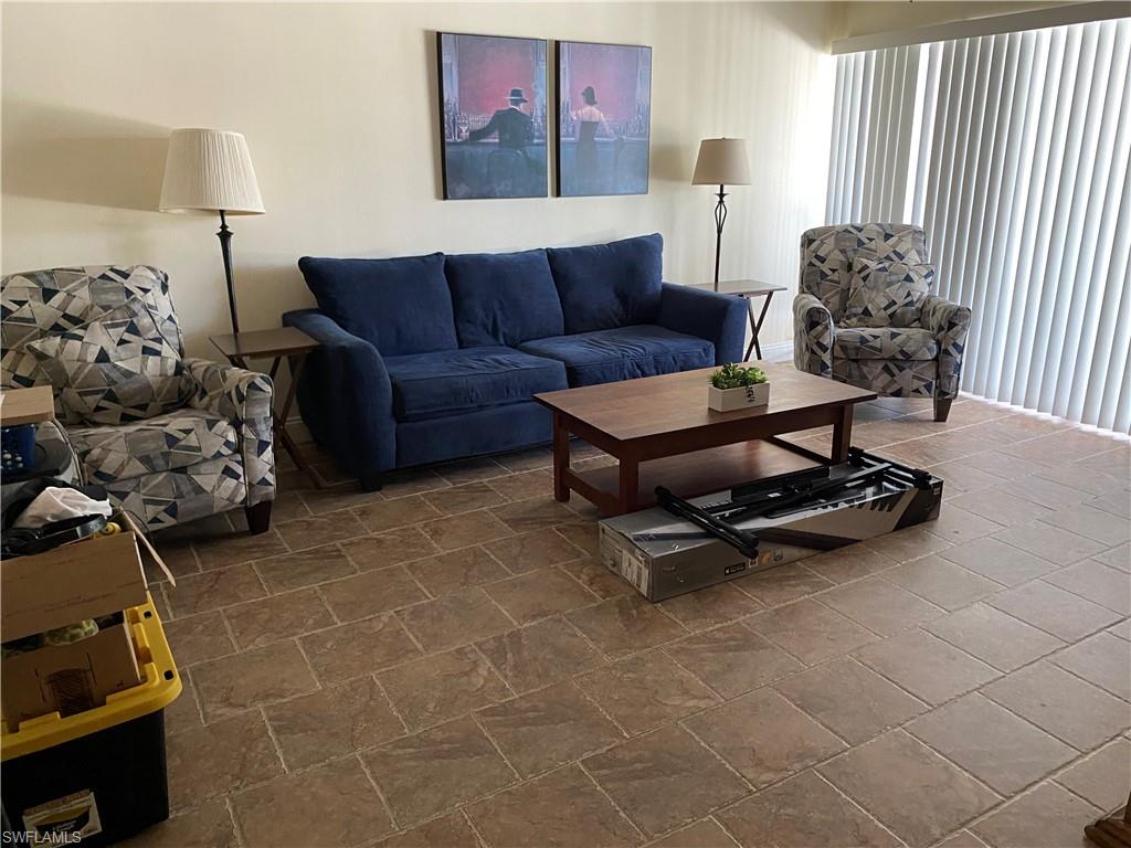 Living room with stone tile floors