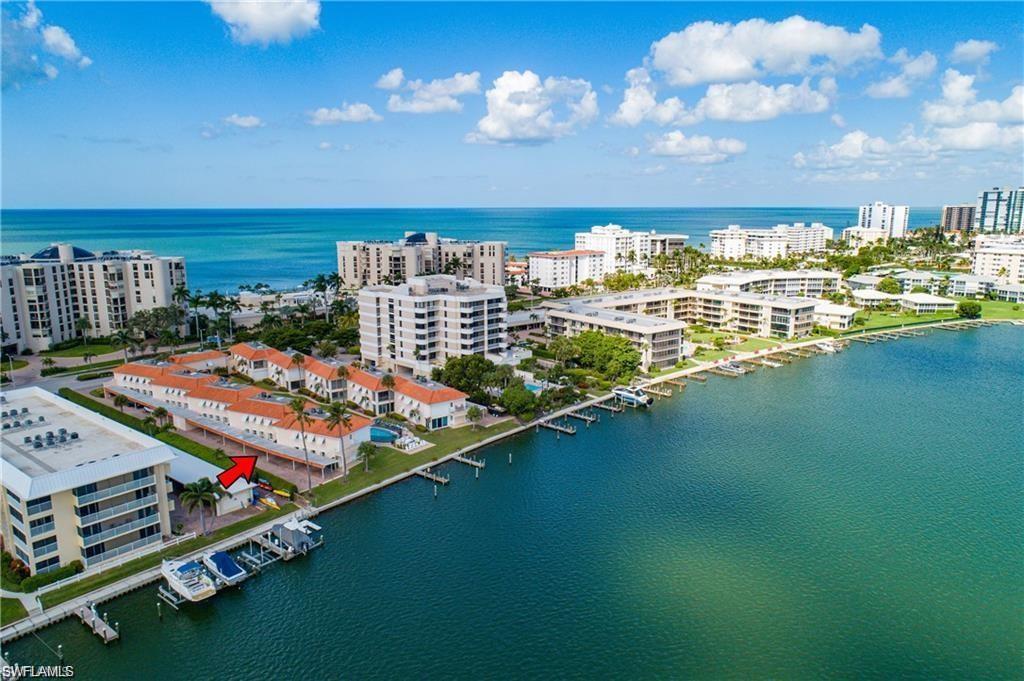 View of urban area with a large body of water and apartment complex