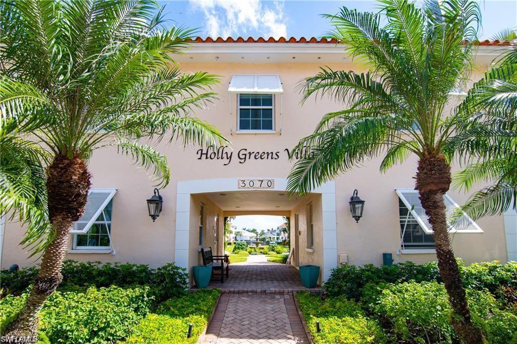 Doorway to property featuring stucco siding