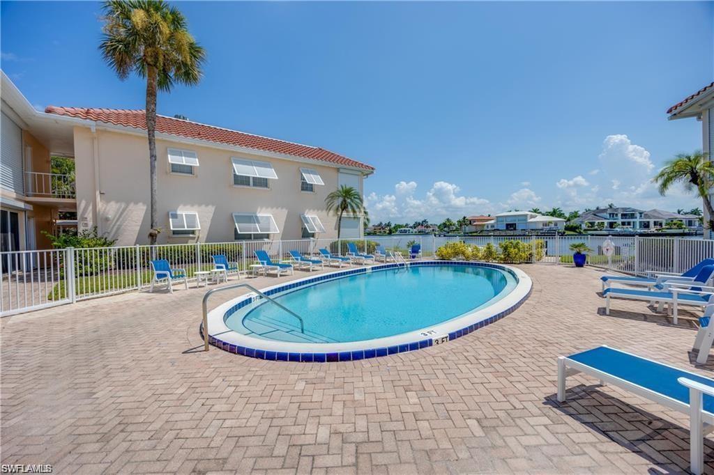Community pool with a patio area