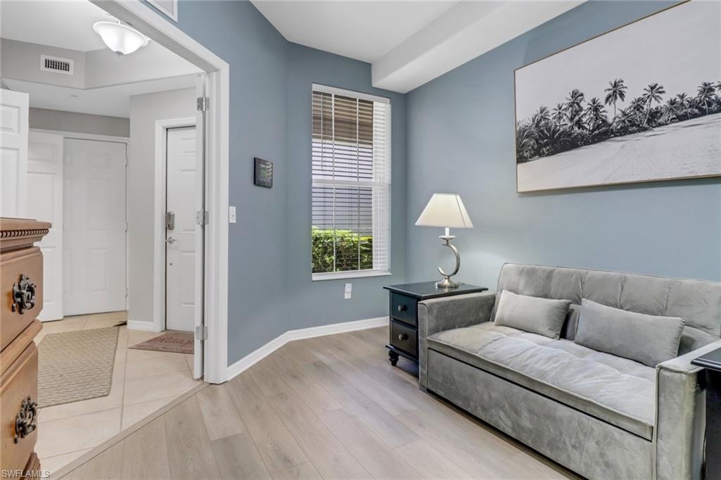Living area featuring light wood finished floors and baseboards