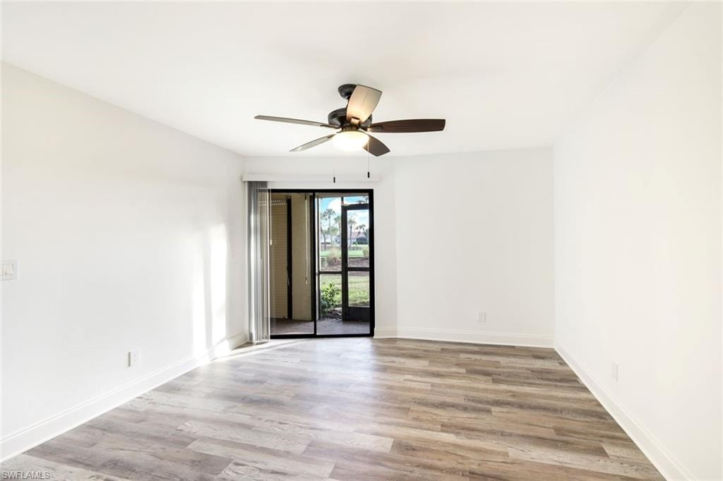Spare room featuring light wood-style flooring and a ceiling fan