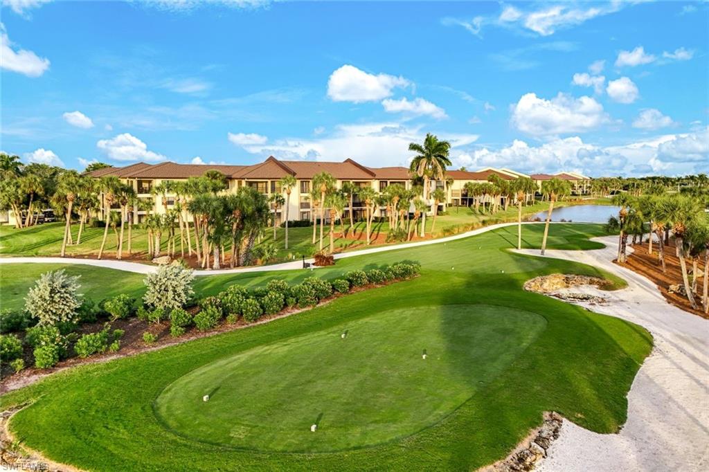 View of community with view of golf course, a putting green, and a residential view