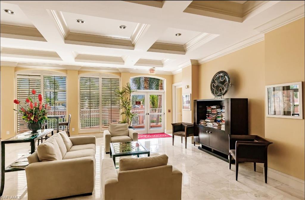 Common area featuring coffered ceiling, beamed ceiling, and ornamental molding