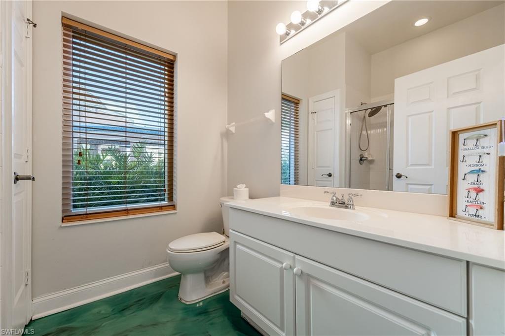 Full bathroom with vanity and a stall shower