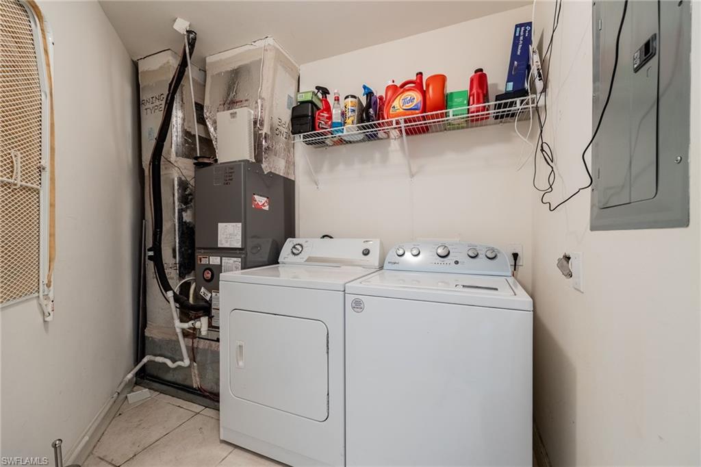 Laundry area with full washer and dryer