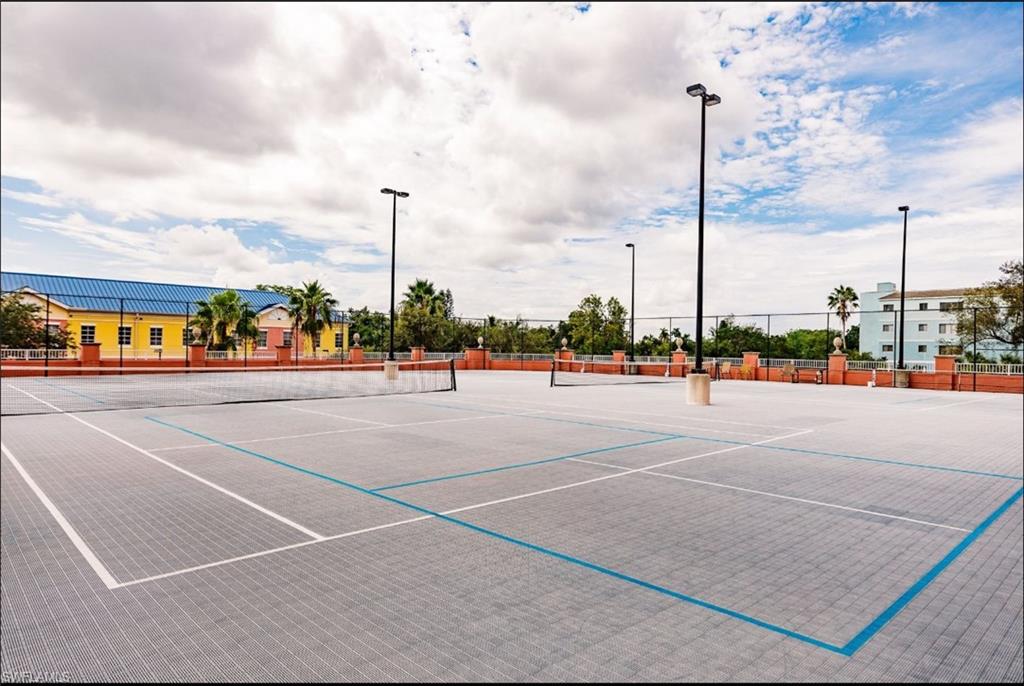 View of tennis court with community pickleball court