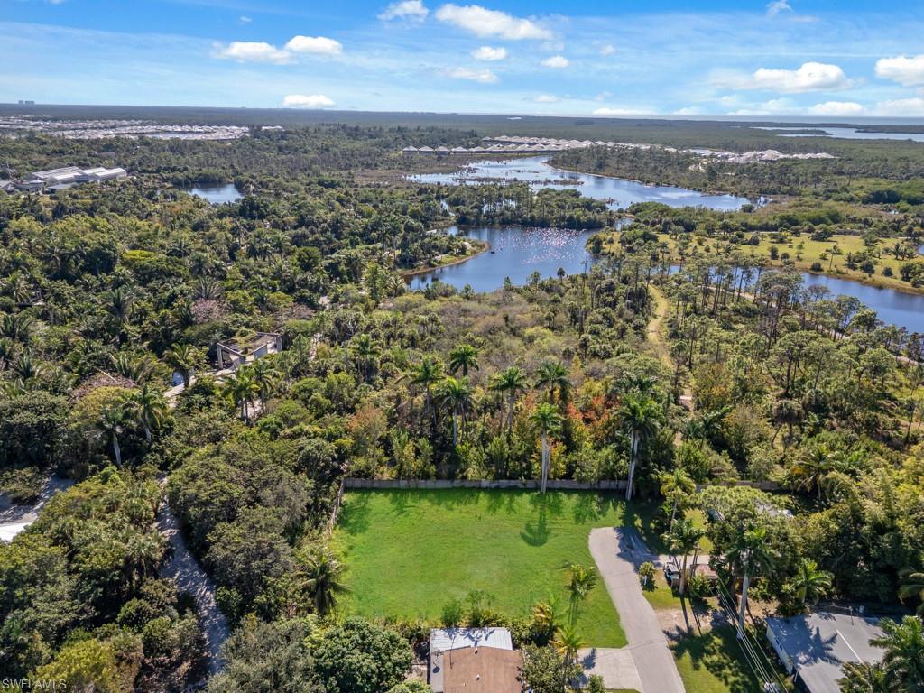 Aerial overview of property's location with a nearby body of water
