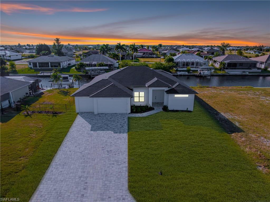 Aerial perspective of suburban area featuring a large body of water