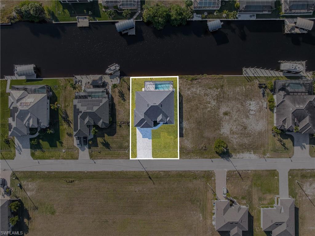 Aerial view of residential area with a nearby body of water