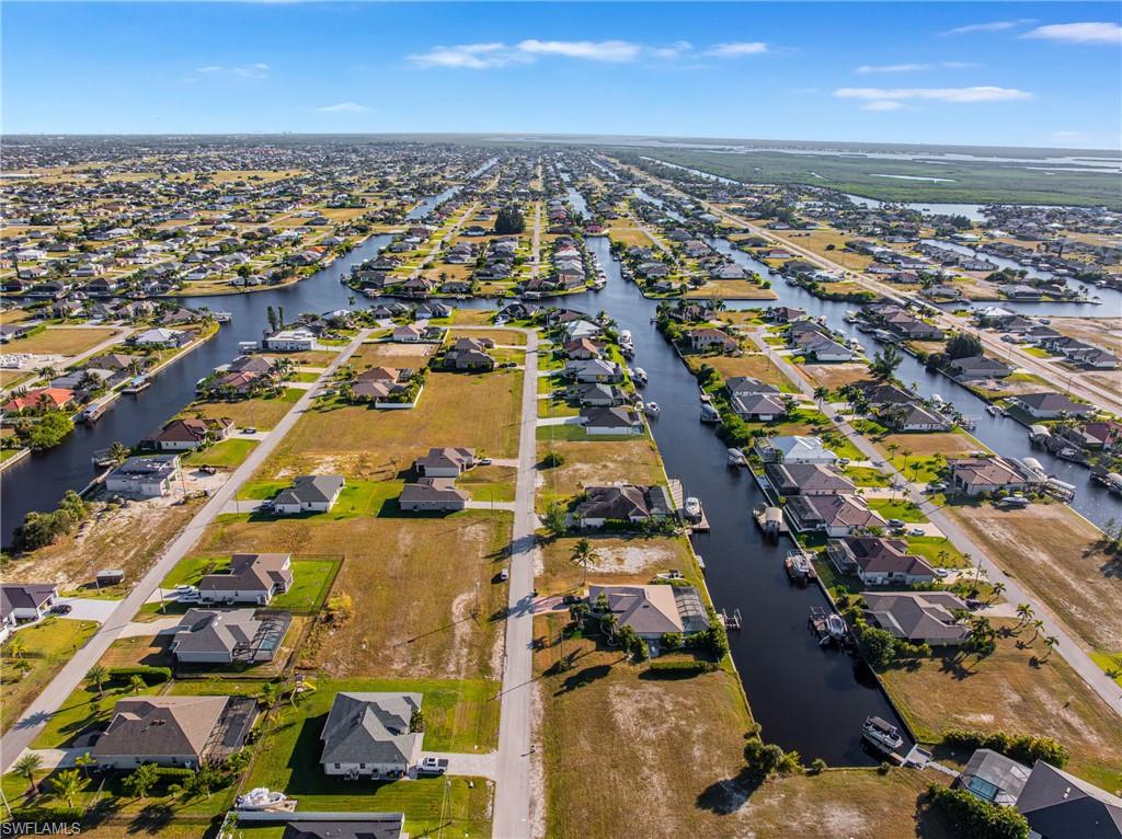 View of property location with nearby suburban area and a nearby body of water