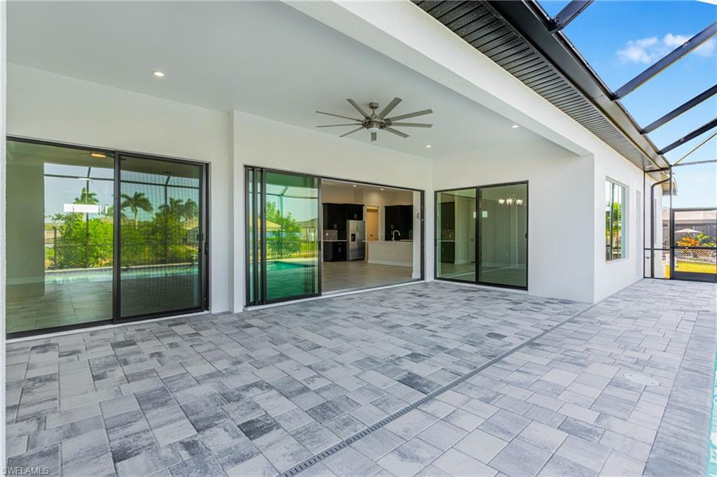 View of patio / terrace with ceiling fan, a sunroom, and a lanai