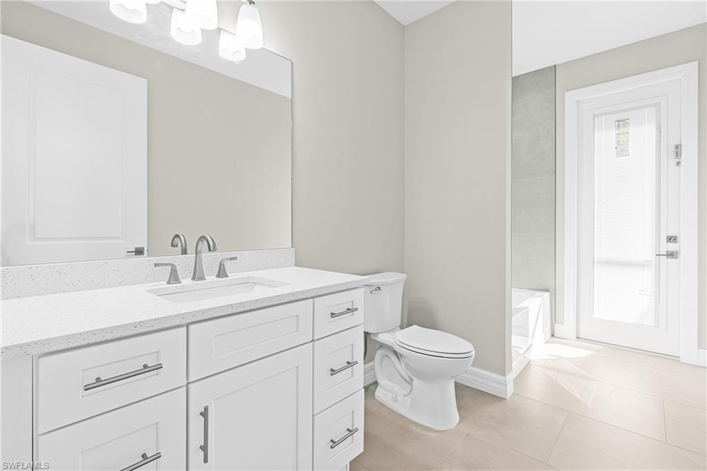 Bathroom featuring vanity and light tile patterned floors
