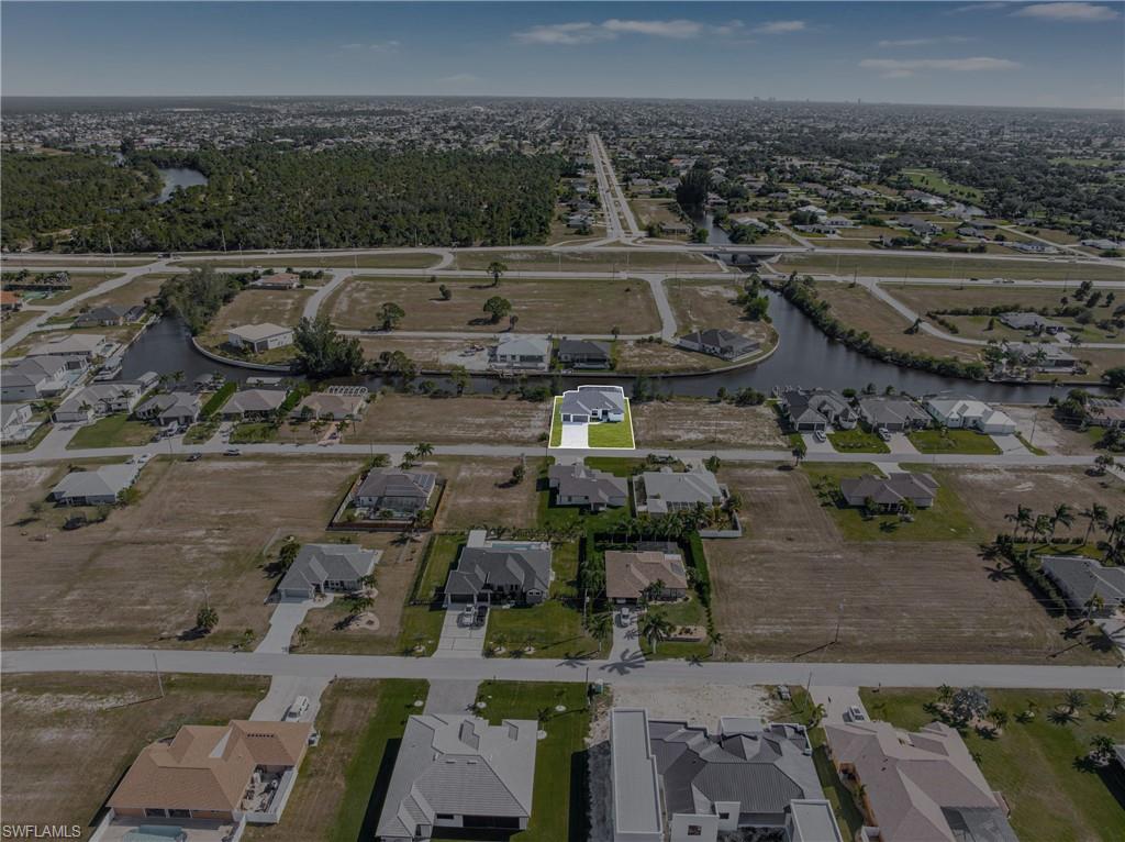 Aerial overview of property's location with nearby suburban area