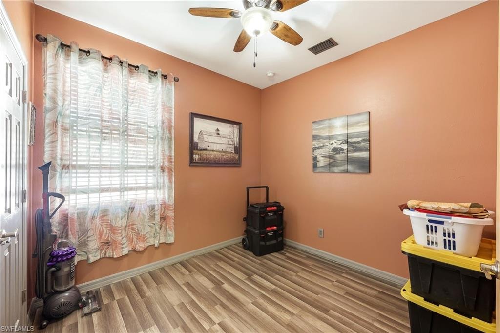 Bedroom with wood finished floors and ceiling fan