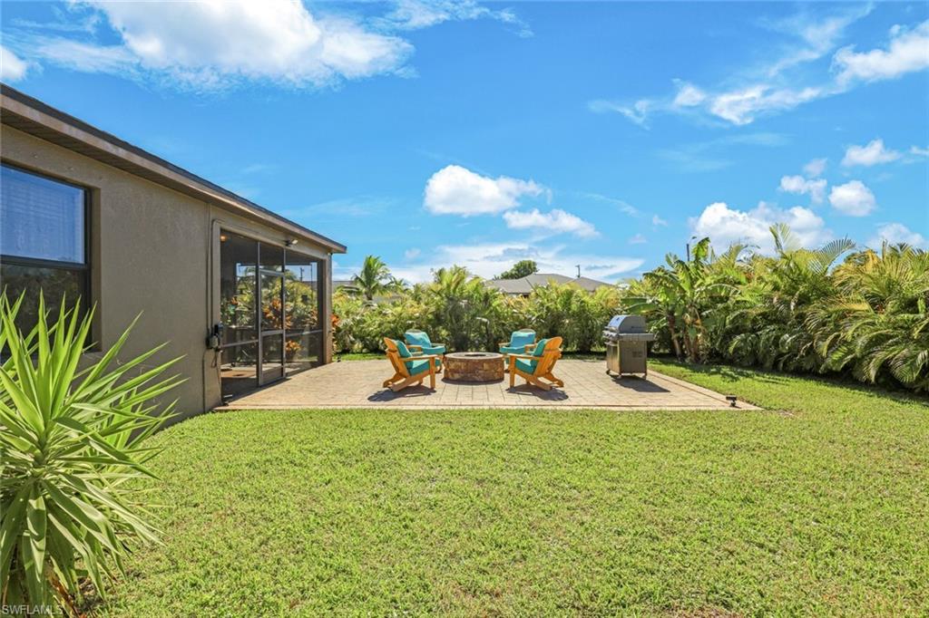 Fenced yard with a patio and a storage shed