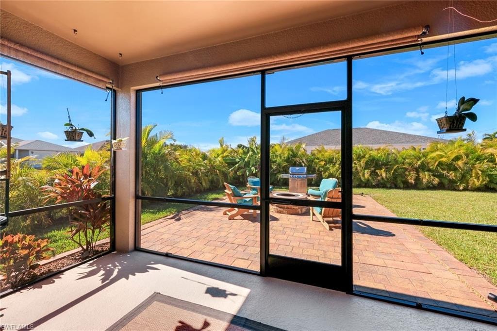 Sunroom with a mountain view