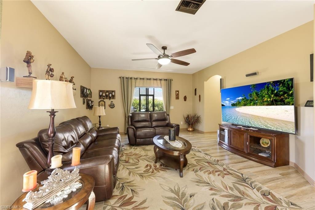 Dining space with a chandelier, light wood-style flooring, and a ceiling fan