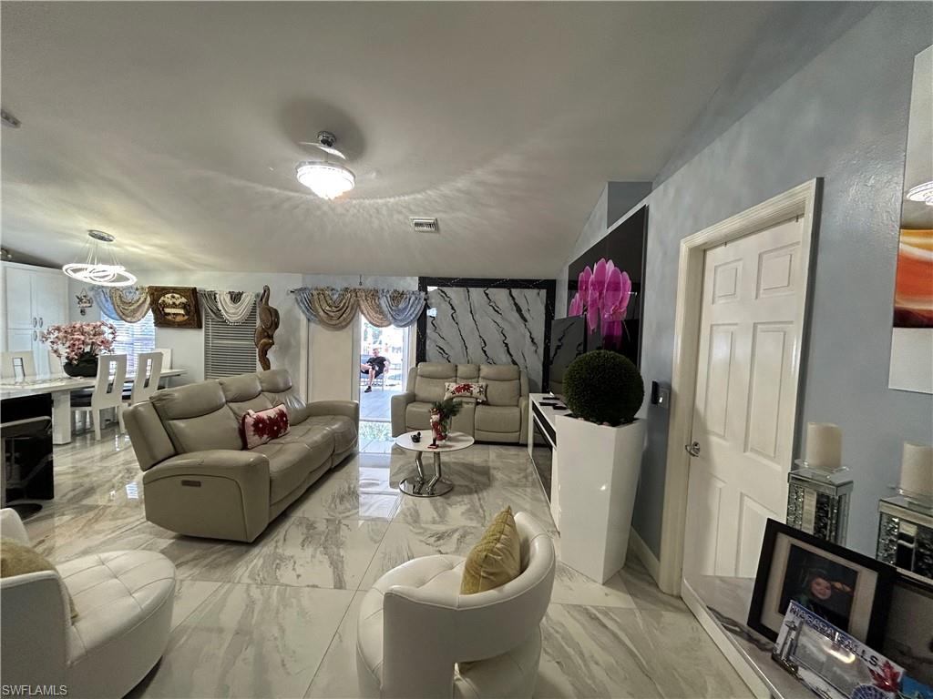 Living area featuring light marble finish flooring