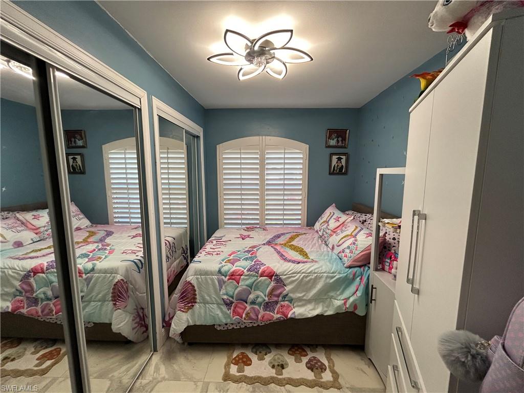 Bedroom with multiple closets