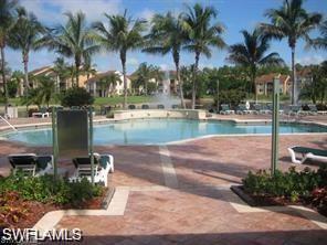 Community pool featuring a patio