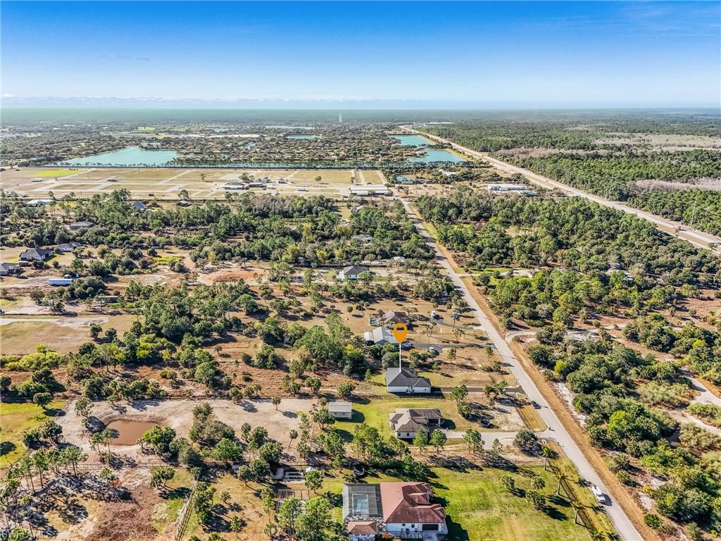 Aerial view of residential area featuring a large body of water