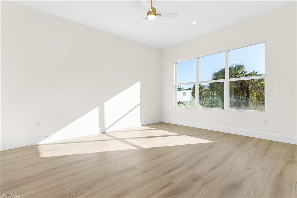 Master Bedroom featuring light wood finished floors and a ceiling fan