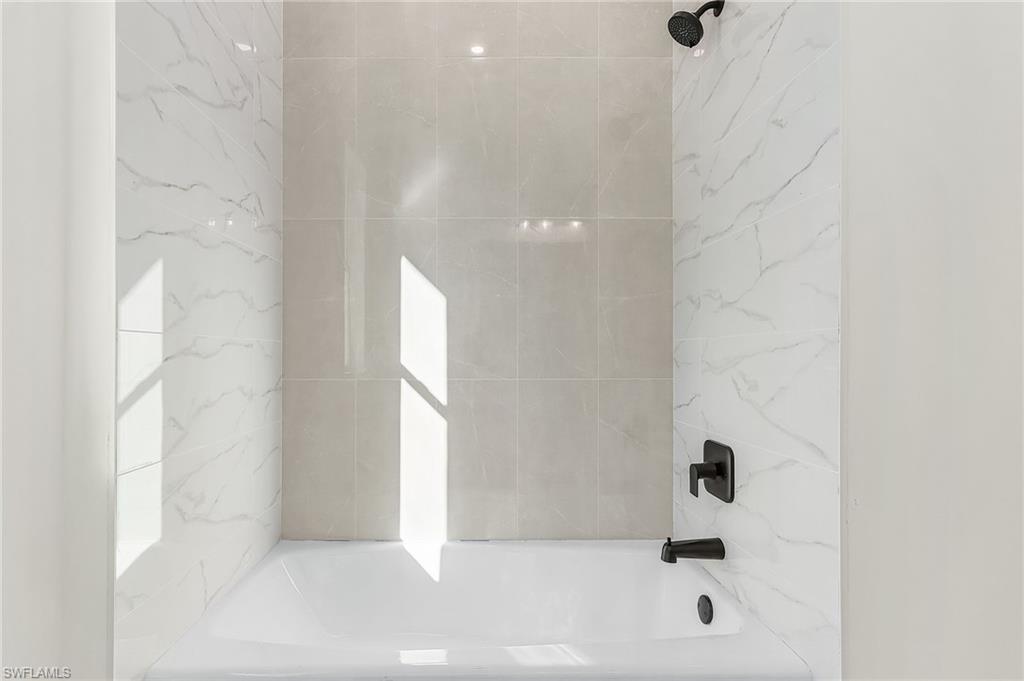 Bathroom featuring shower / bath combination