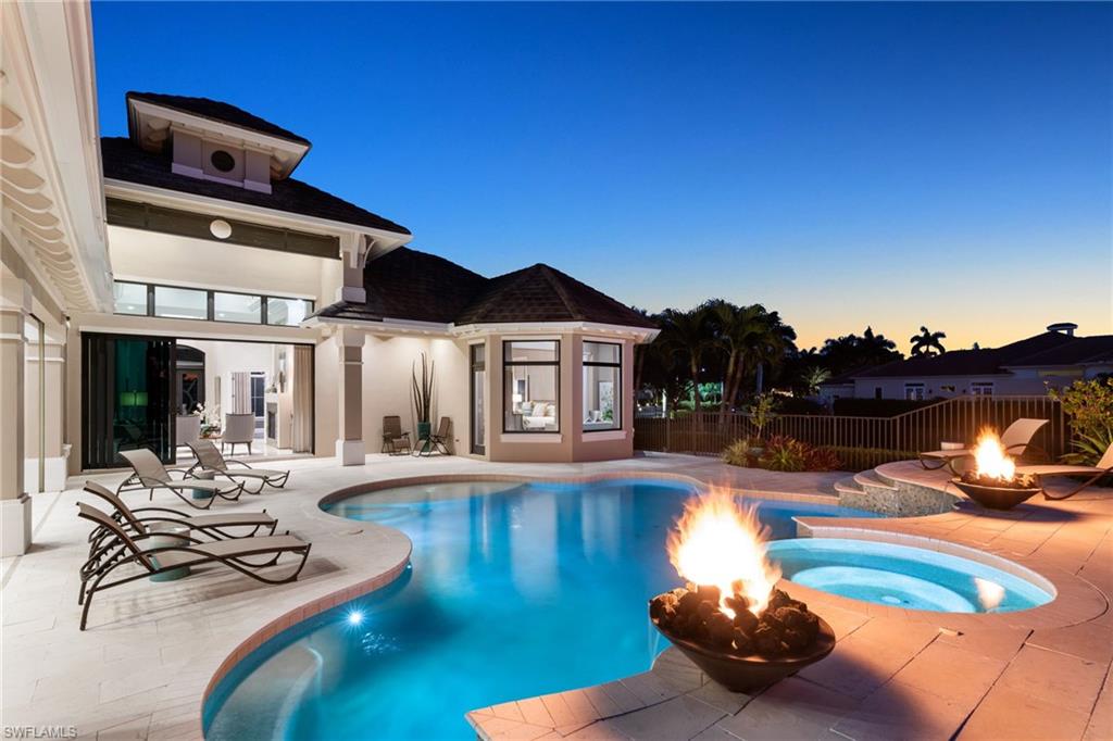 Pool with spa and decorative fireballs