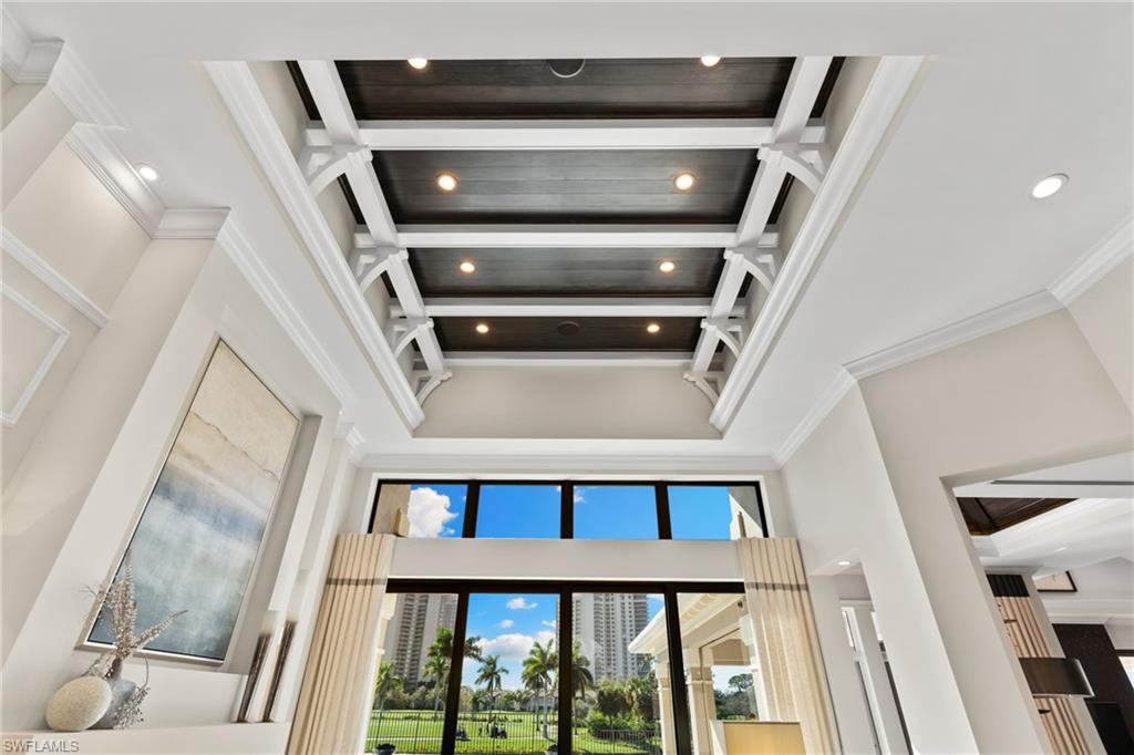 Detailed view of recessed lighting,crown molding and ceiling detail.