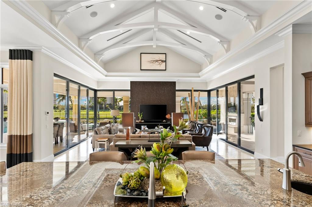 Common area with a sink and a high ceiling