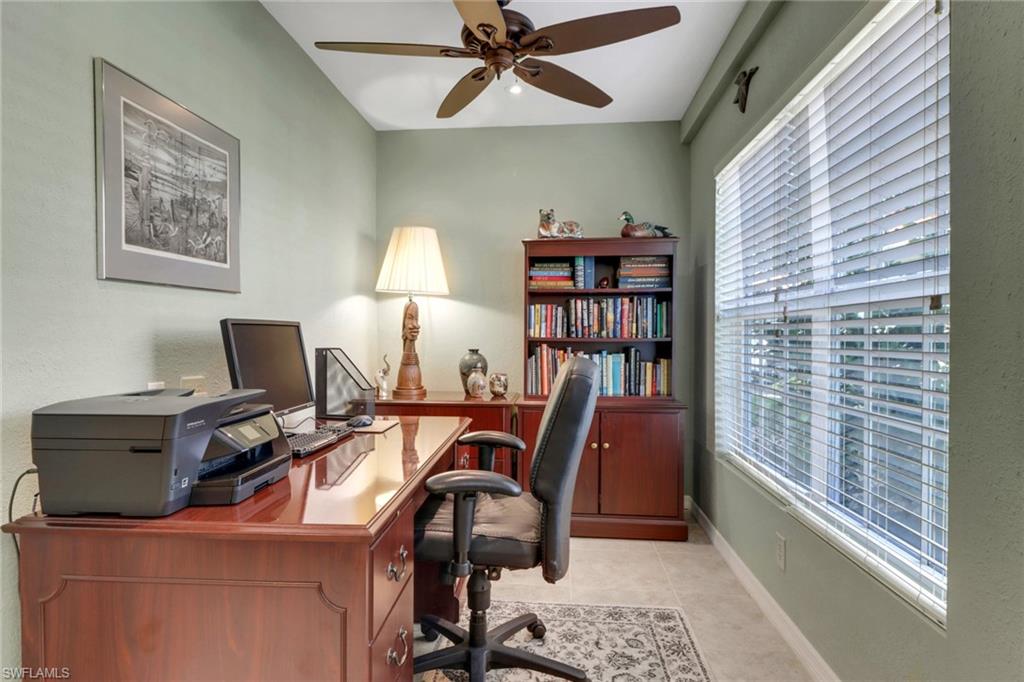 Tiled office with a wealth of natural light and ceiling fan